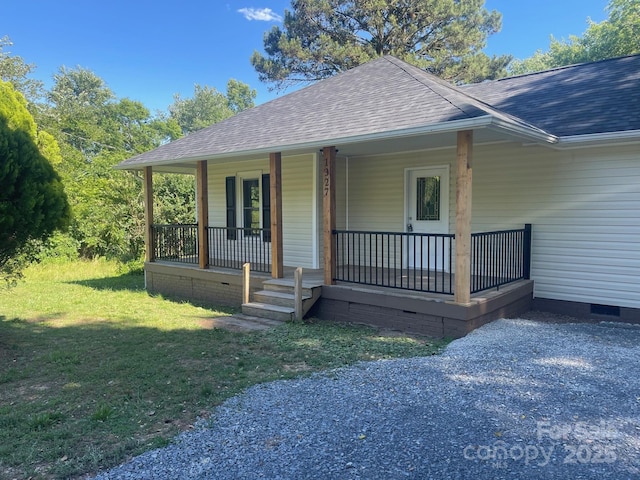 1327 Wiscassett St, Albemarle, NC 28001 - view of front of property featuring roof with shingles, a porch, crawl space, and a front yard