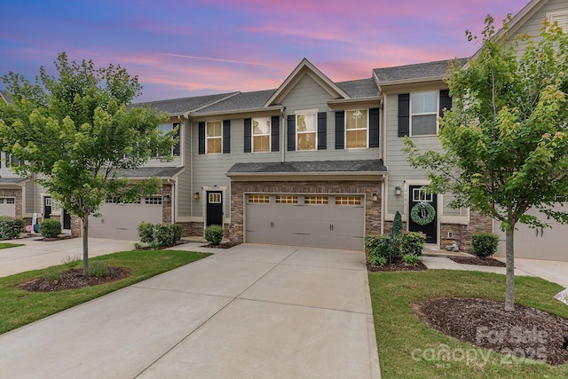 138 Lanyard Dr Unit B, Mooresville, NC 28117 - multi unit property featuring concrete driveway, an attached garage, and stone siding