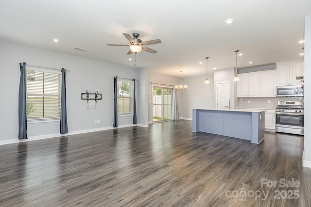138 Lanyard Dr Unit B, Mooresville, NC 28117 - unfurnished living room featuring recessed lighting, a chandelier, a ceiling fan, dark wood finished floors, and baseboards