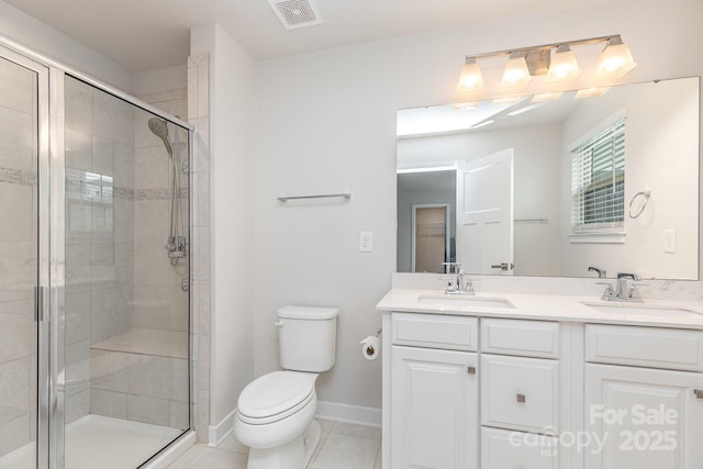 138 Lanyard Dr Unit B, Mooresville, NC 28117 - bathroom featuring toilet, double vanity, a shower stall, and tile patterned floors