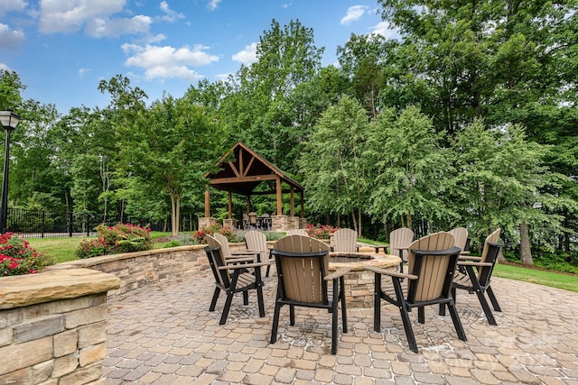 138 Lanyard Dr Unit B, Mooresville, NC 28117 - view of patio featuring a fire pit, a gazebo, and view of scattered trees