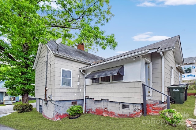 117 Young Ave SW, Concord, NC 28025 - view of side of home featuring a lawn and a chimney