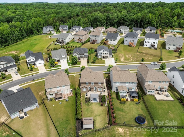 2835 Berkhamstead Cir, Concord, NC 28027 - aerial perspective of suburban area with a heavily wooded area