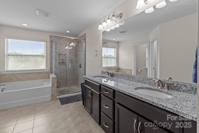 2835 Berkhamstead Cir, Concord, NC 28027 - full bath with tile patterned flooring, a shower stall, double vanity, and a garden tub