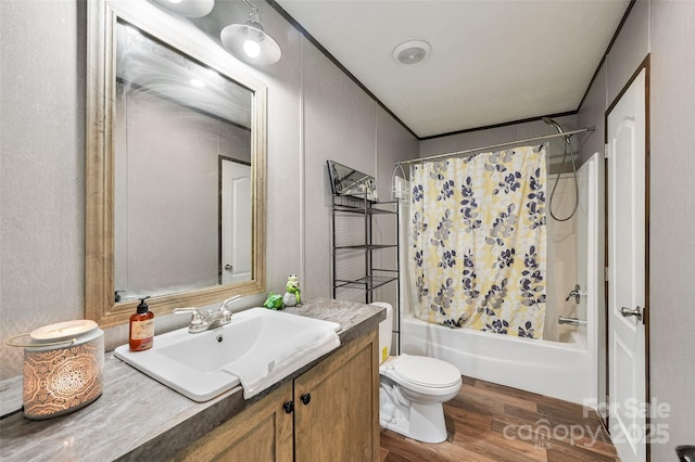 full bathroom featuring shower / tub combo with curtain, wood finished floors, toilet, and vanity