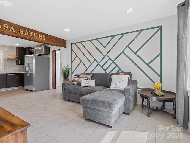 living room with beamed ceiling and recessed lighting