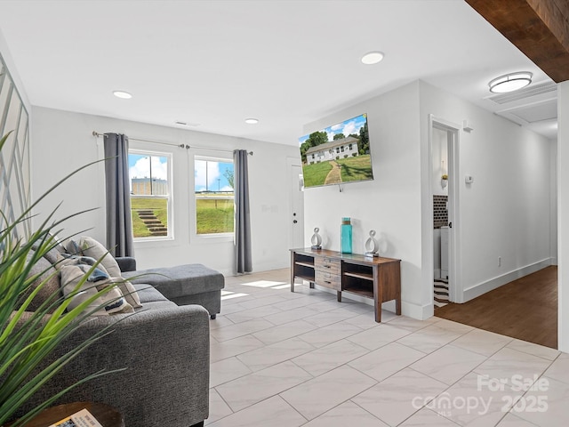 living area featuring recessed lighting and light tile patterned floors