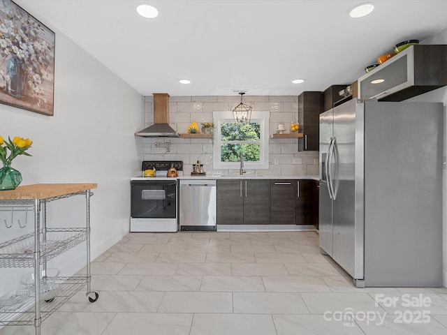 kitchen featuring appliances with stainless steel finishes, wall chimney exhaust hood, open shelves, a sink, and light countertops