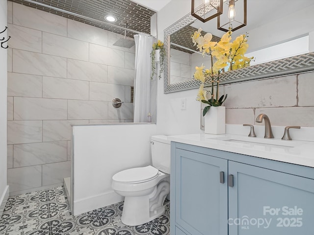 full bathroom featuring walk in shower, toilet, vanity, and tile patterned floors