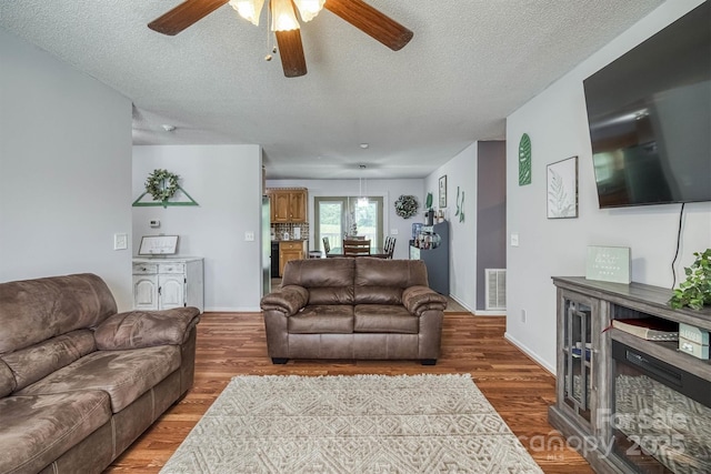 905 Severt Cir, Lenoir, NC 28645 - living area with a ceiling fan, a textured ceiling, and wood finished floors