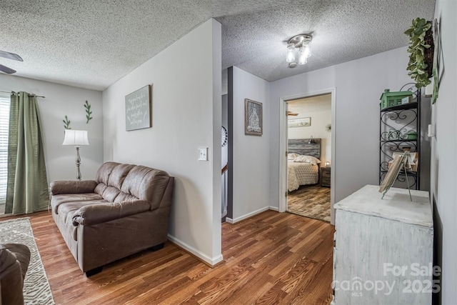 905 Severt Cir, Lenoir, NC 28645 - living area with wood finished floors, a textured ceiling, and baseboards