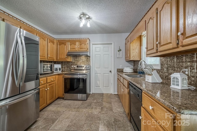 905 Severt Cir, Lenoir, NC 28645 - kitchen featuring stainless steel appliances, exhaust hood, backsplash, dark stone countertops, and a sink