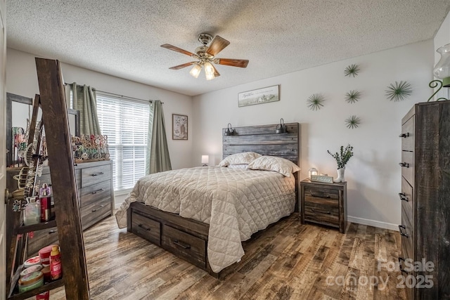905 Severt Cir, Lenoir, NC 28645 - bedroom with wood finished floors, a textured ceiling, ceiling fan, and baseboards