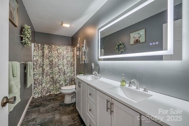905 Severt Cir, Lenoir, NC 28645 - full bathroom with toilet, double vanity, a textured ceiling, curtained shower, and baseboards