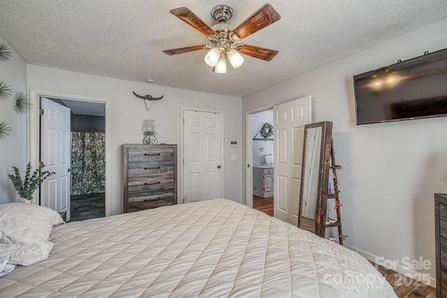 905 Severt Cir, Lenoir, NC 28645 - bedroom featuring a textured ceiling, baseboards, wood finished floors, a ceiling fan, and ensuite bathroom