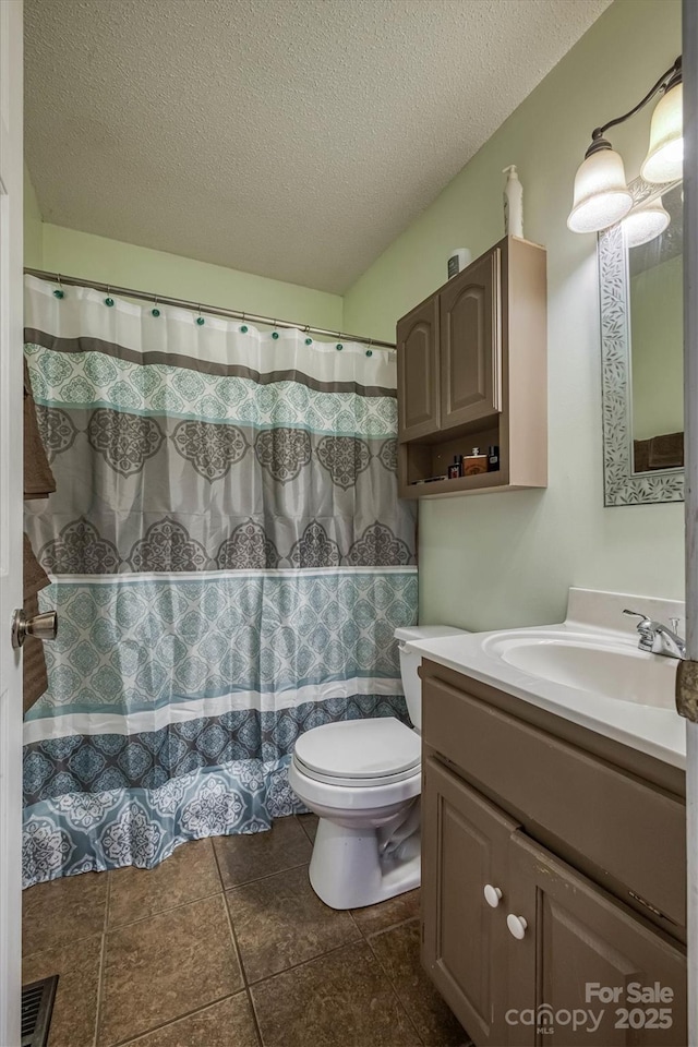 905 Severt Cir, Lenoir, NC 28645 - bathroom featuring vanity, toilet, a textured ceiling, and tile patterned floors