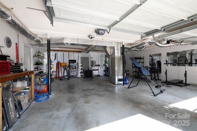 905 Severt Cir, Lenoir, NC 28645 - garage featuring a garage door opener and heating unit