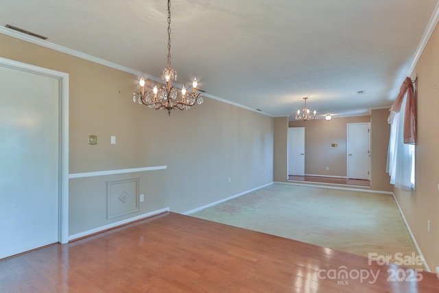 466 Shiloh Church Rd, Hickory, NC 28601 - spare room featuring a chandelier, ornamental molding, and light wood-style floors