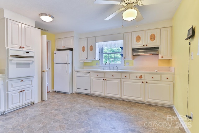 466 Shiloh Church Rd, Hickory, NC 28601 - kitchen with white appliances, under cabinet range hood, light stone finish floors, light countertops, and a ceiling fan