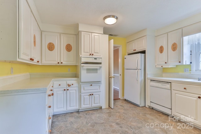 466 Shiloh Church Rd, Hickory, NC 28601 - kitchen featuring white appliances, light countertops, light stone finish floors, and white cabinets