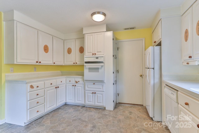 466 Shiloh Church Rd, Hickory, NC 28601 - kitchen featuring white appliances, light countertops, white cabinets, and light stone finish floors