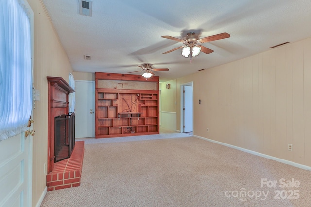 466 Shiloh Church Rd, Hickory, NC 28601 - unfurnished living room featuring a fireplace, carpet floors, and a ceiling fan