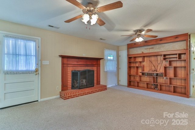 466 Shiloh Church Rd, Hickory, NC 28601 - unfurnished living room featuring a ceiling fan, a brick fireplace, and carpet floors