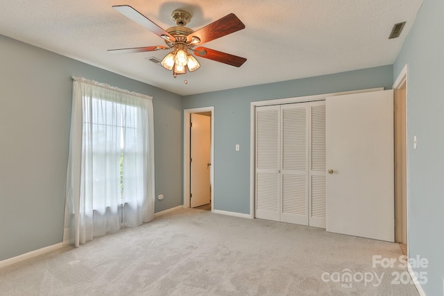 466 Shiloh Church Rd, Hickory, NC 28601 - unfurnished bedroom with carpet floors, a closet, a textured ceiling, and ceiling fan