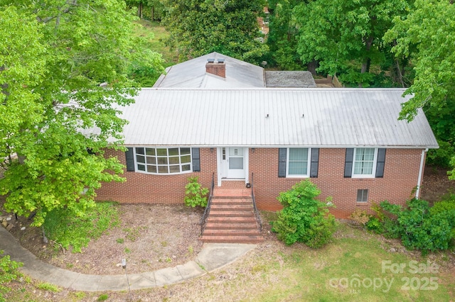 466 Shiloh Church Rd, Hickory, NC 28601 - view of front of house with brick siding, a metal roof, and a chimney