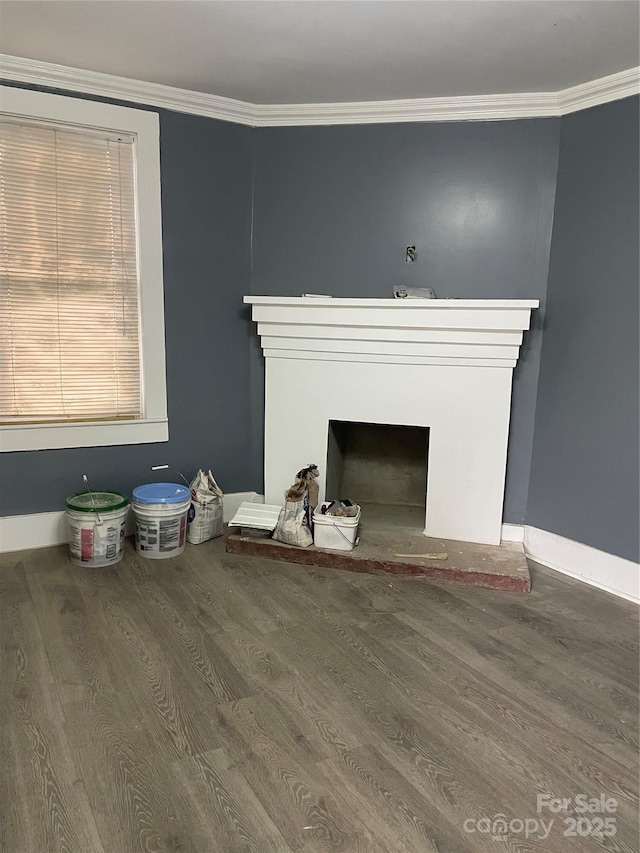 836 Mccreary St, Winston Salem, NC 27105 - unfurnished living room with a fireplace with raised hearth, wood finished floors, ornamental molding, and baseboards