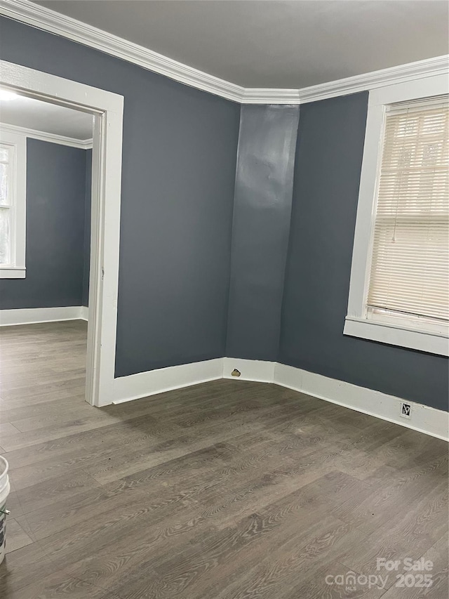 836 Mccreary St, Winston Salem, NC 27105 - spare room with ornamental molding, wood finished floors, and baseboards