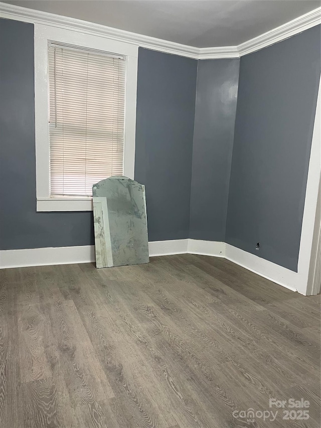 836 Mccreary St, Winston Salem, NC 27105 - spare room featuring crown molding, wood finished floors, and baseboards