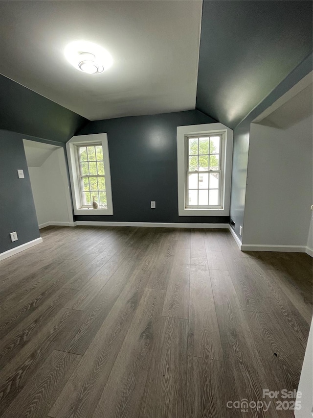 836 Mccreary St, Winston Salem, NC 27105 - bonus room featuring vaulted ceiling, dark wood finished floors, baseboards, and plenty of natural light