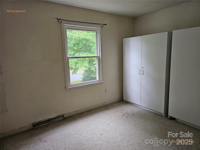 7608 Surreywood Pl, Charlotte, NC 28270 - unfurnished bedroom featuring light colored carpet