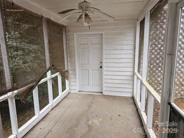 7608 Surreywood Pl, Charlotte, NC 28270 - unfurnished sunroom featuring a ceiling fan