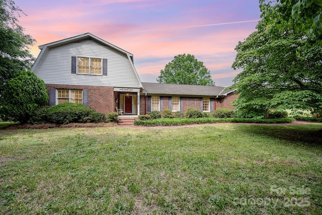 4630 Woodleaf Rd, Salisbury, NC 28147 - dutch colonial with brick siding, a gambrel roof, and a lawn