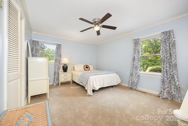 4630 Woodleaf Rd, Salisbury, NC 28147 - carpeted bedroom with ornamental molding, baseboards, ceiling fan, and a closet