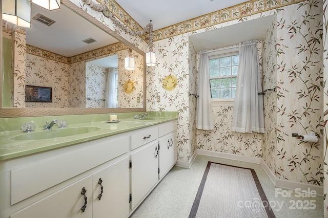 4630 Woodleaf Rd, Salisbury, NC 28147 - full bath featuring wallpapered walls, baseboards, and double vanity