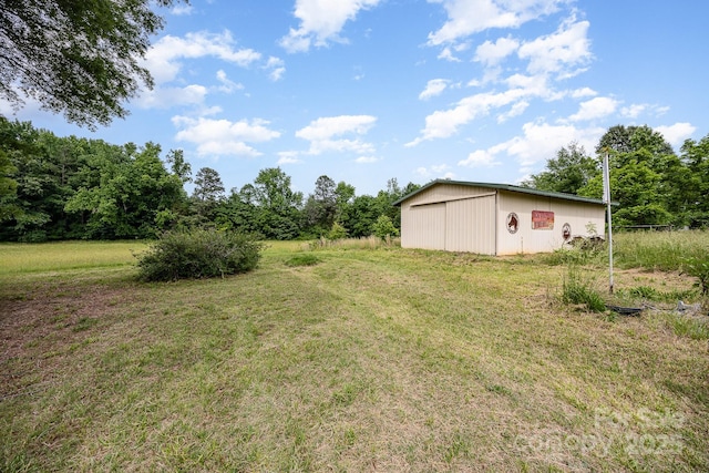 4630 Woodleaf Rd, Salisbury, NC 28147 - view of grassy yard with an outbuilding and an outdoor structure