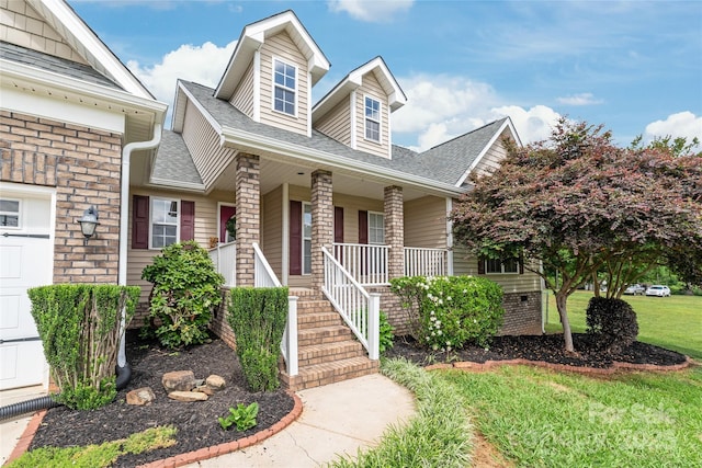 8717 Swift Rd, Oakboro, NC 28129 - view of front of property featuring a porch, roof with shingles, and a front lawn