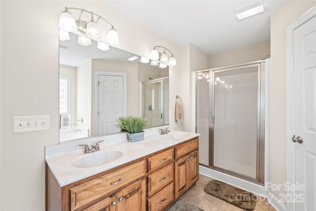8717 Swift Rd, Oakboro, NC 28129 - full bath featuring a shower stall, double vanity, tile patterned flooring, and a garden tub