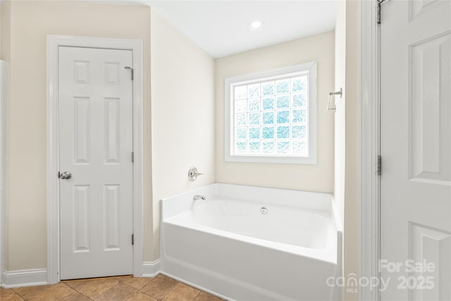 8717 Swift Rd, Oakboro, NC 28129 - bathroom with a garden tub, baseboards, and tile patterned flooring