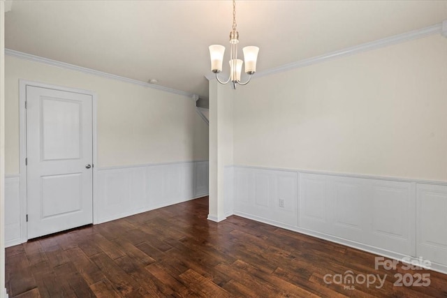 2515 Walnut Forest Dr, Charlotte, NC 28216 - empty room featuring a chandelier, dark wood-style floors, crown molding, and wainscoting