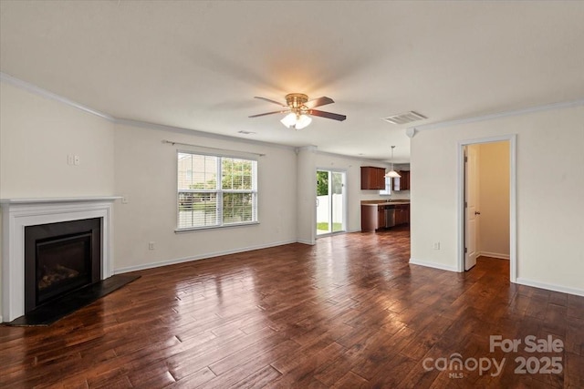 2515 Walnut Forest Dr, Charlotte, NC 28216 - unfurnished living room with a ceiling fan, ornamental molding, dark wood-type flooring, a fireplace, and baseboards