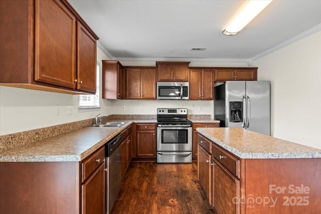 2515 Walnut Forest Dr, Charlotte, NC 28216 - kitchen featuring stainless steel appliances, a sink, dark wood finished floors, a center island, and crown molding