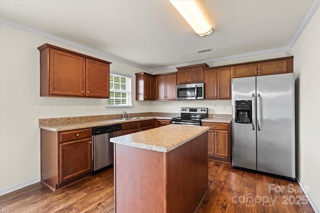 2515 Walnut Forest Dr, Charlotte, NC 28216 - kitchen with appliances with stainless steel finishes, a sink, crown molding, dark wood-style floors, and light countertops