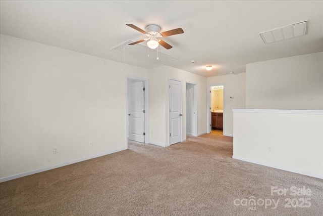 2515 Walnut Forest Dr, Charlotte, NC 28216 - spare room with attic access, light carpet, ceiling fan, and baseboards