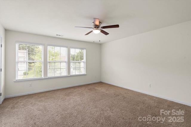 2515 Walnut Forest Dr, Charlotte, NC 28216 - carpeted spare room featuring ceiling fan and baseboards