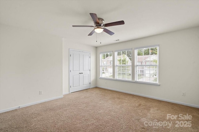 2515 Walnut Forest Dr, Charlotte, NC 28216 - carpeted spare room featuring baseboards and ceiling fan