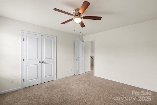 2515 Walnut Forest Dr, Charlotte, NC 28216 - unfurnished bedroom with carpet floors, baseboards, ceiling fan, and a closet